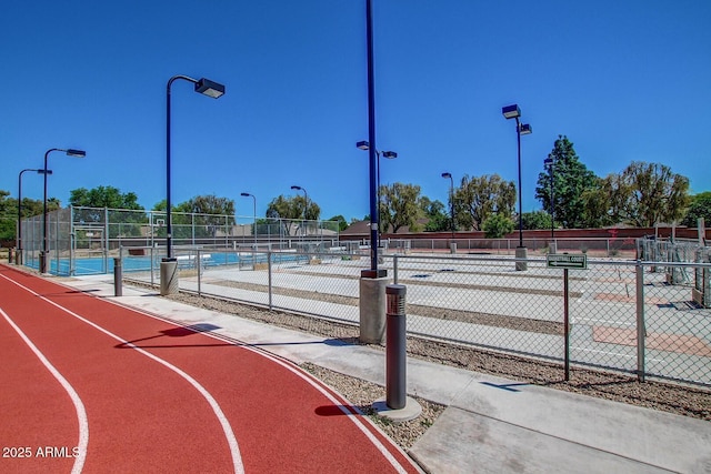 view of basketball court featuring tennis court