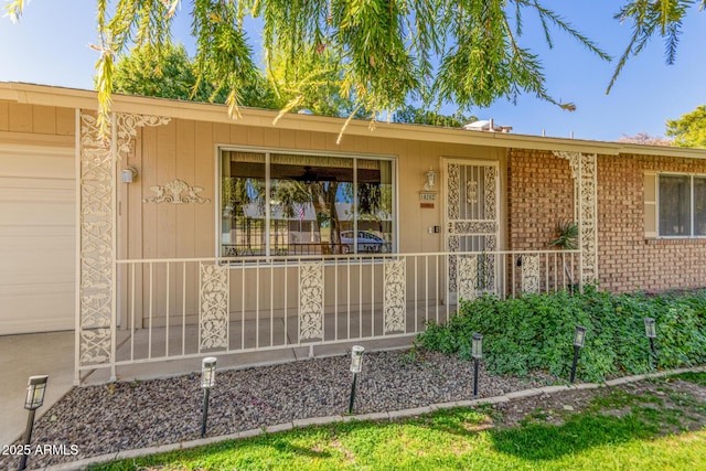 view of exterior entry featuring a garage