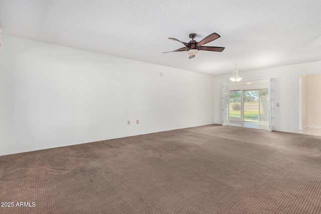 unfurnished room featuring a textured ceiling, light carpet, and ceiling fan with notable chandelier