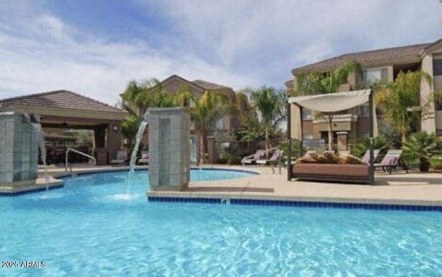 community pool with a patio