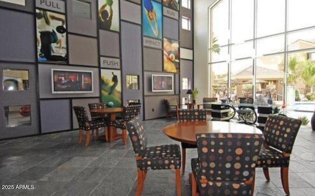 dining space with a high ceiling