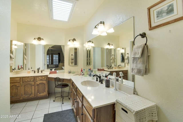 bathroom featuring tile patterned flooring and vanity