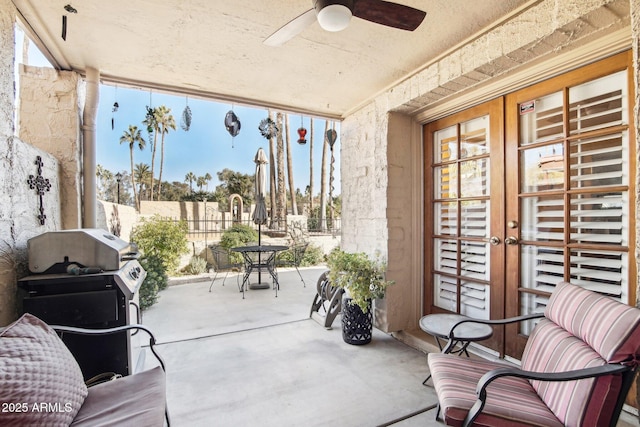 view of patio featuring french doors and ceiling fan