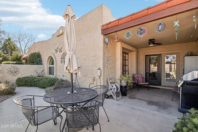 view of patio / terrace featuring a grill and ceiling fan