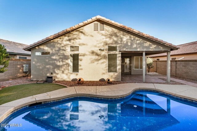 view of swimming pool with a patio area