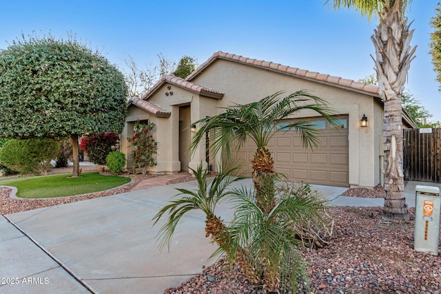 mediterranean / spanish house with a garage and a front lawn