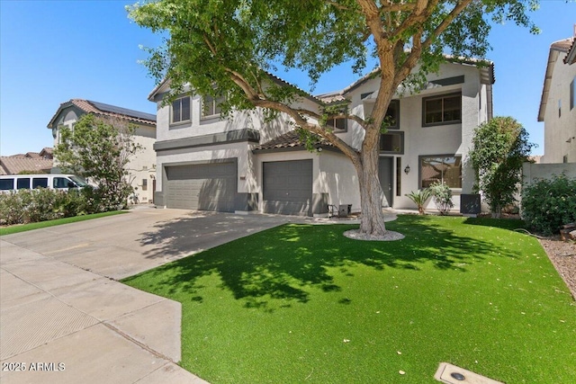 view of front facade with a garage, a front yard, stucco siding, a tiled roof, and concrete driveway
