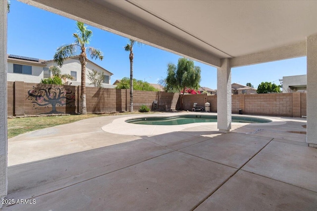 view of pool featuring a fenced backyard, a fenced in pool, and a patio area