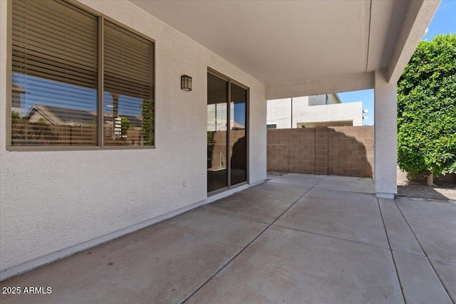 view of patio / terrace featuring fence