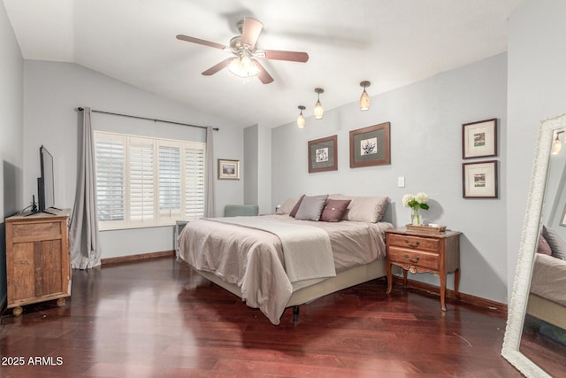 bedroom with dark wood-type flooring, baseboards, and vaulted ceiling