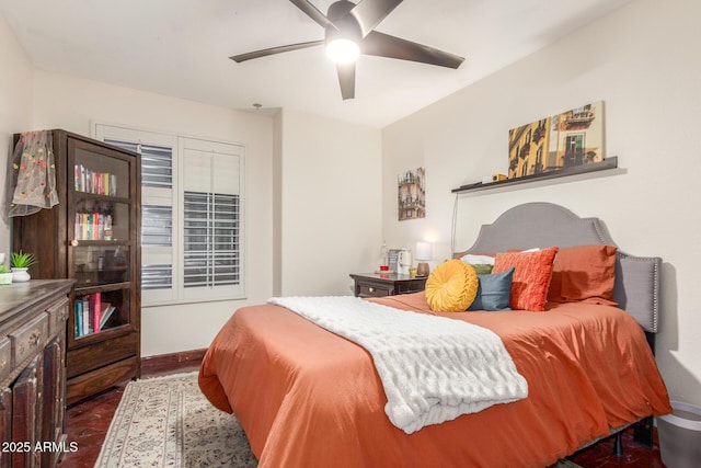 bedroom with baseboards and ceiling fan