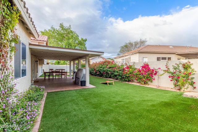 view of yard featuring a patio and a fenced backyard