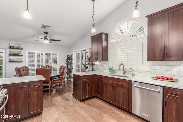 kitchen with a sink, visible vents, dishwasher, and a healthy amount of sunlight