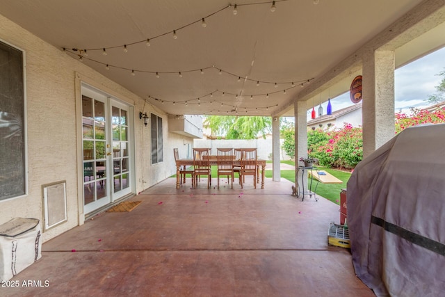 view of patio / terrace featuring area for grilling, outdoor dining area, and fence