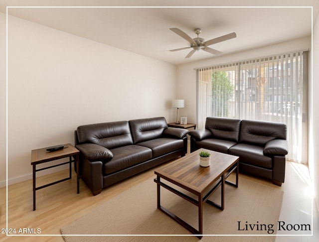 living room featuring light hardwood / wood-style floors and ceiling fan