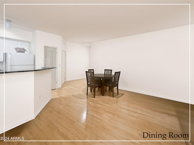 dining room with light hardwood / wood-style floors