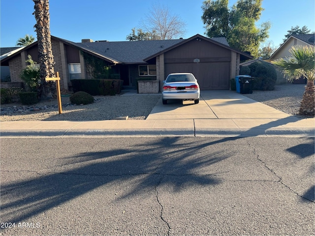 ranch-style house featuring a garage