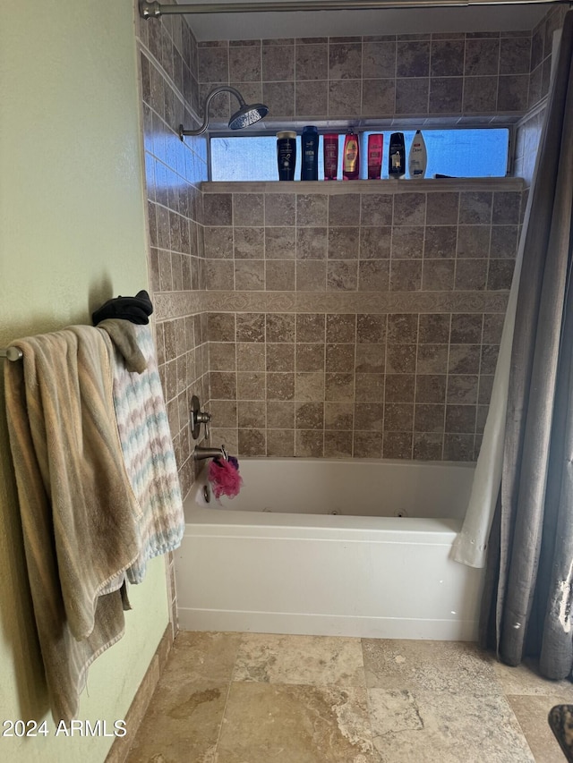 bathroom with shower / bathtub combination with curtain