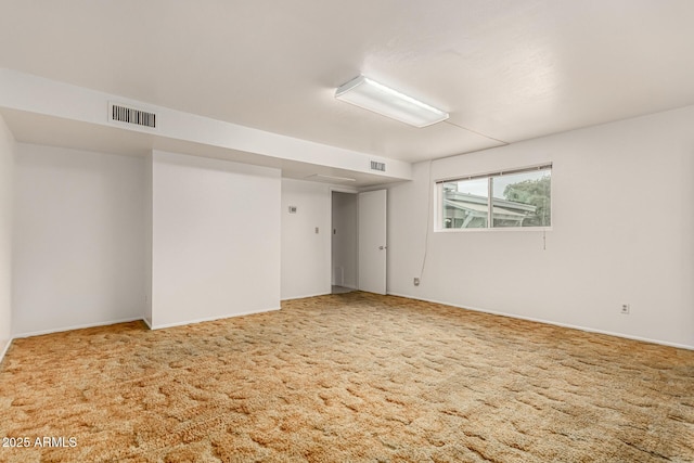 carpeted spare room with visible vents