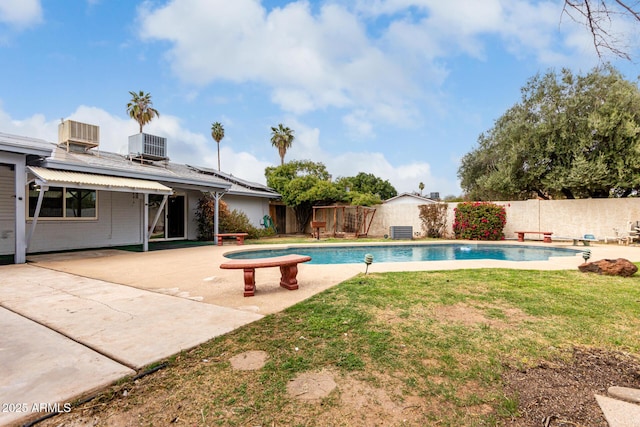 view of pool featuring a fenced in pool, cooling unit, a fenced backyard, and a patio