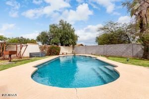 view of swimming pool featuring a patio area, a fenced backyard, and a fenced in pool