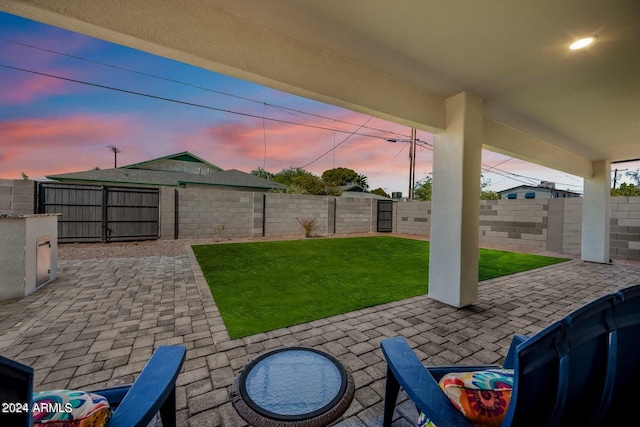 patio terrace at dusk with a lawn