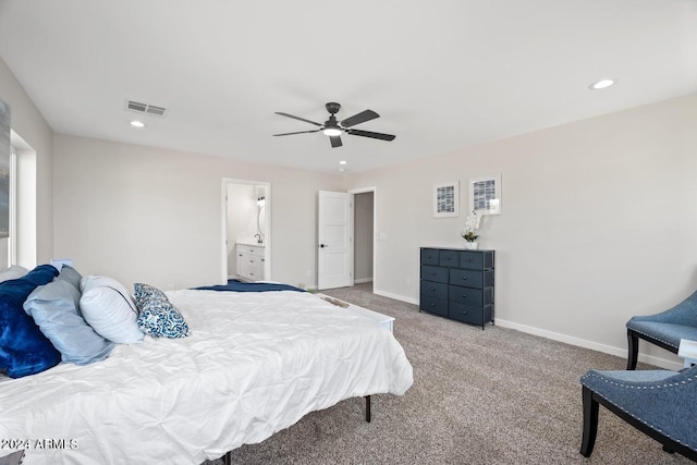 bedroom with carpet flooring, ensuite bathroom, and ceiling fan