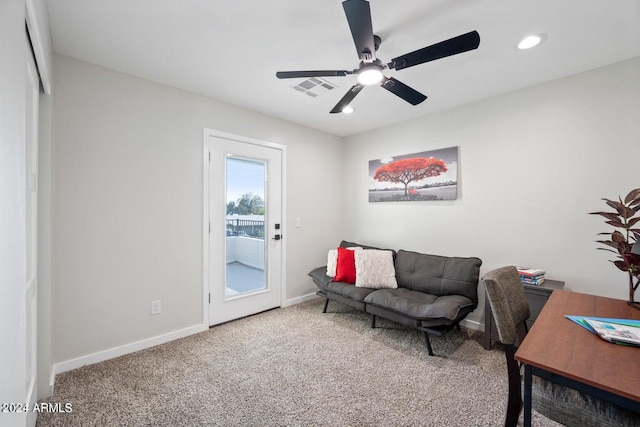 interior space with carpet flooring and ceiling fan