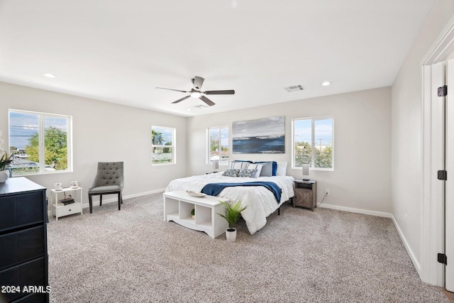 bedroom with light carpet and ceiling fan