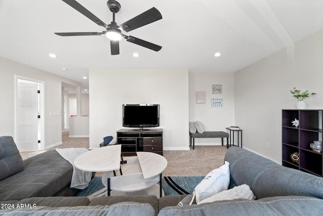 carpeted living room featuring ceiling fan