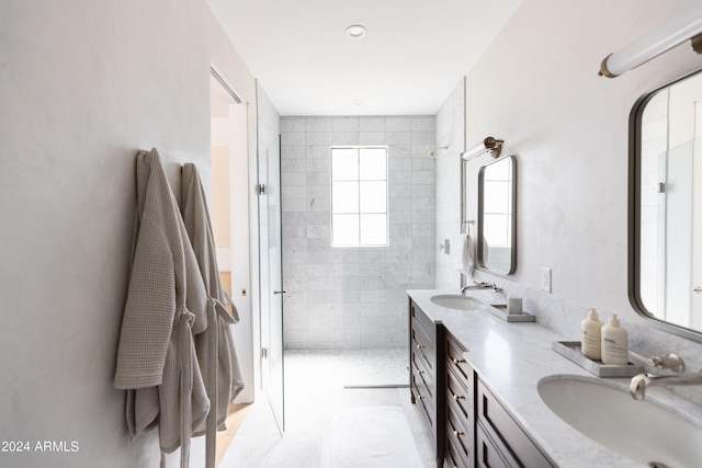 bathroom featuring a shower, tile patterned flooring, and vanity