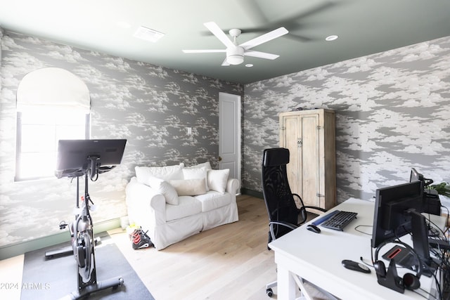 office space featuring ceiling fan and light wood-type flooring