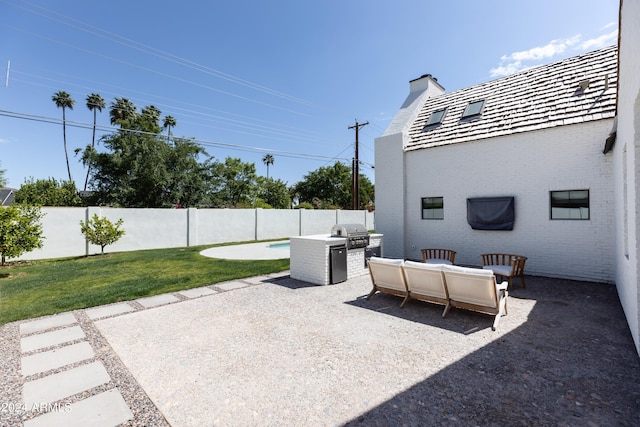 view of patio with an outdoor living space and area for grilling