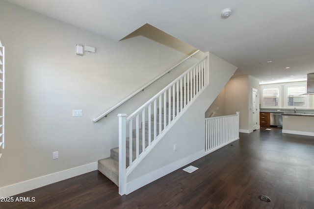 stairway featuring hardwood / wood-style flooring