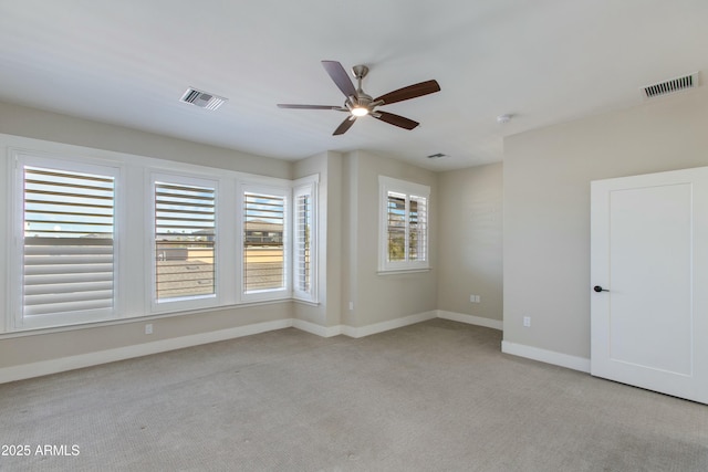 carpeted empty room with ceiling fan