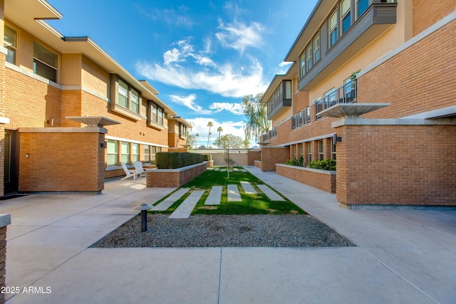 view of home's community featuring a patio