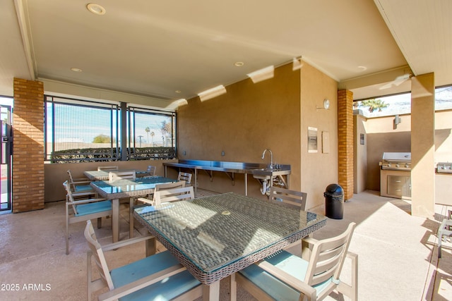 view of patio / terrace featuring sink and a grill