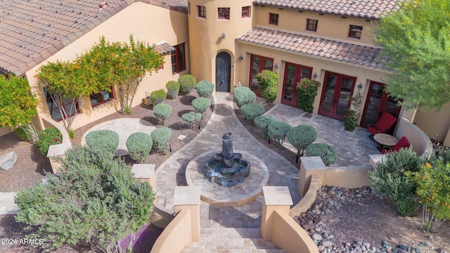 view of front of home with french doors and a patio