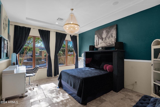 bedroom featuring a chandelier