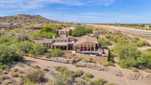 birds eye view of property with a mountain view