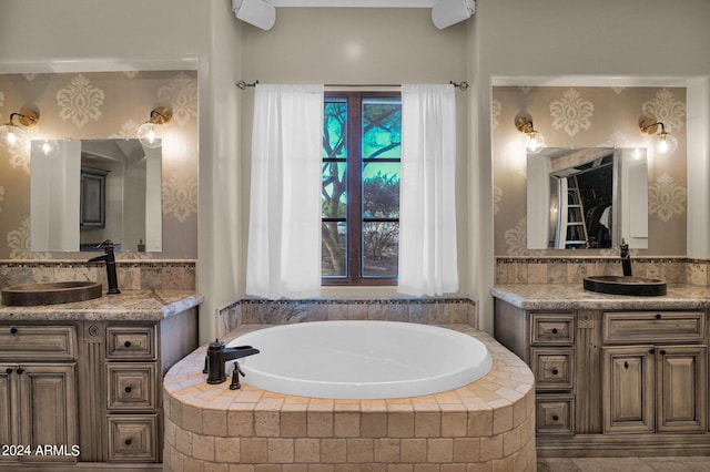 bathroom with vanity and a relaxing tiled tub