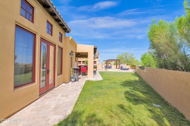 view of yard with a pergola and a patio