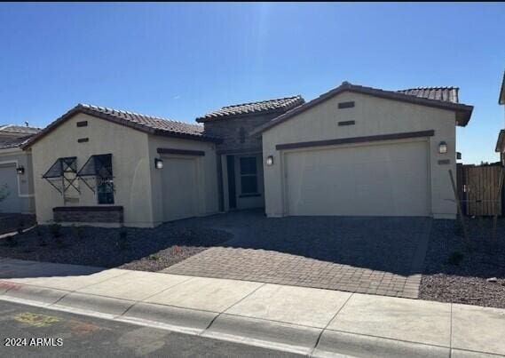 mediterranean / spanish house featuring a garage