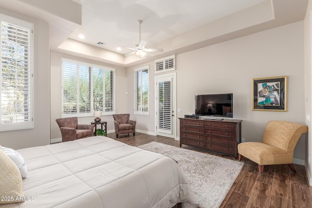 3205 S Ponderosa Dr, Gold Canyon, AZ 85118 - bedroom featuring baseboards, recessed lighting, dark wood-type flooring, a tray ceiling, and access to exterior