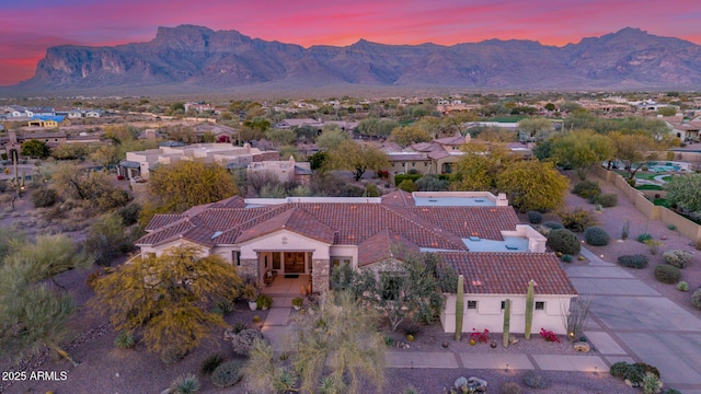 aerial view at dusk with a mountain view