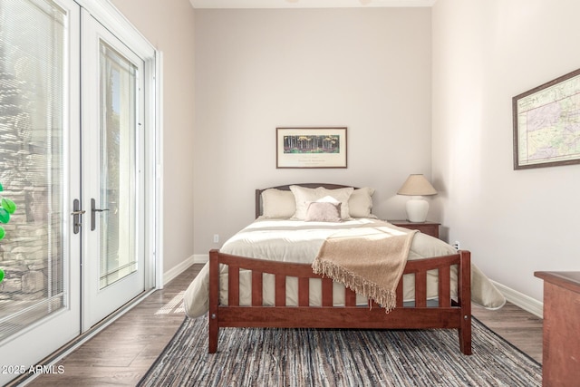 3205 S Ponderosa Dr, Gold Canyon, AZ 85118 - bedroom featuring access to outside, multiple windows, baseboards, and wood finished floors