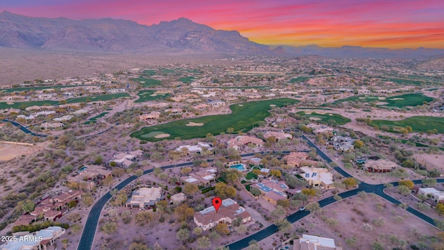 aerial view at dusk featuring a mountain view