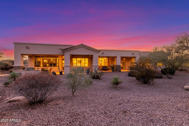 3205 S Ponderosa Dr, Gold Canyon, AZ 85118 - back of house at dusk featuring stucco siding