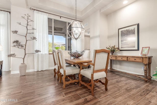 3205 S Ponderosa Dr, Gold Canyon, AZ 85118 - dining room featuring a notable chandelier, baseboards, visible vents, a raised ceiling, and wood finished floors