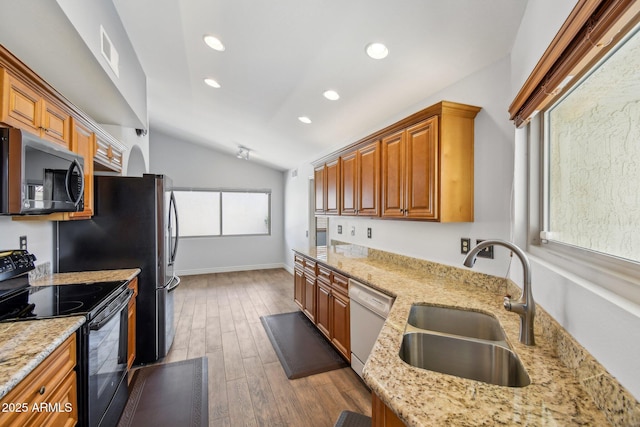 kitchen featuring black electric range, stainless steel microwave, visible vents, a sink, and white dishwasher